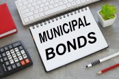 Municipal bonds notepad with text on white keyboard