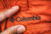 Embroidered logo Columbia on red clothes