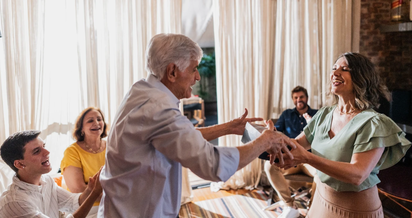 Family dancing in living room