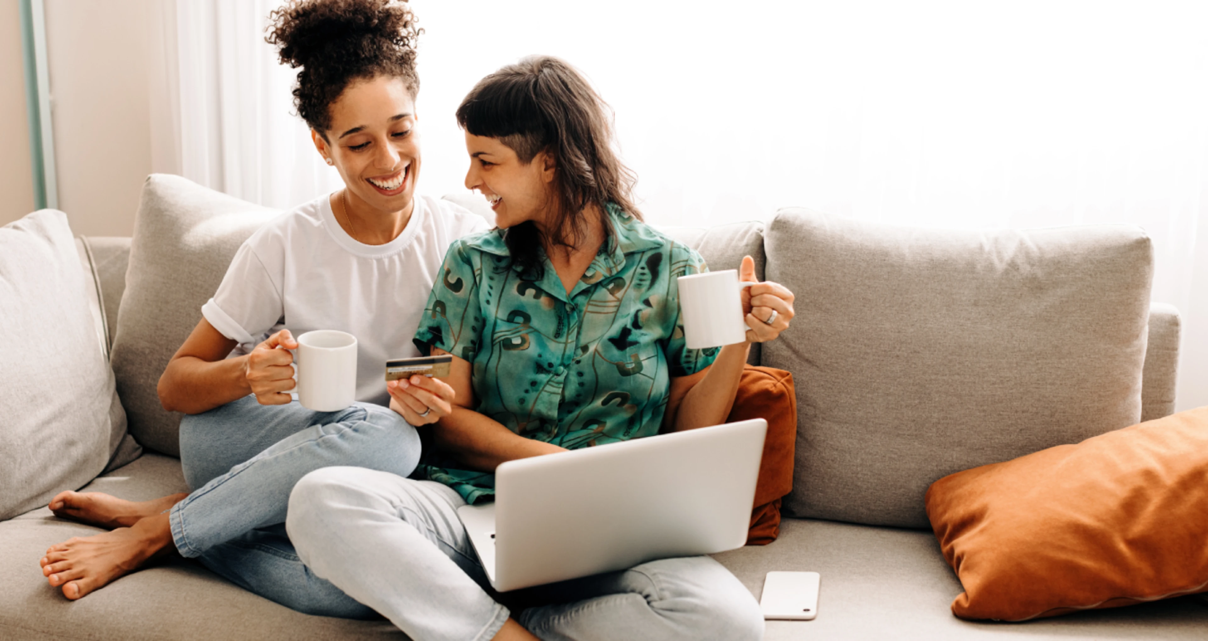 Couple on couch on laptop