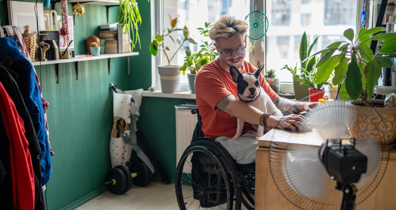 Guy in wheelchair with pug