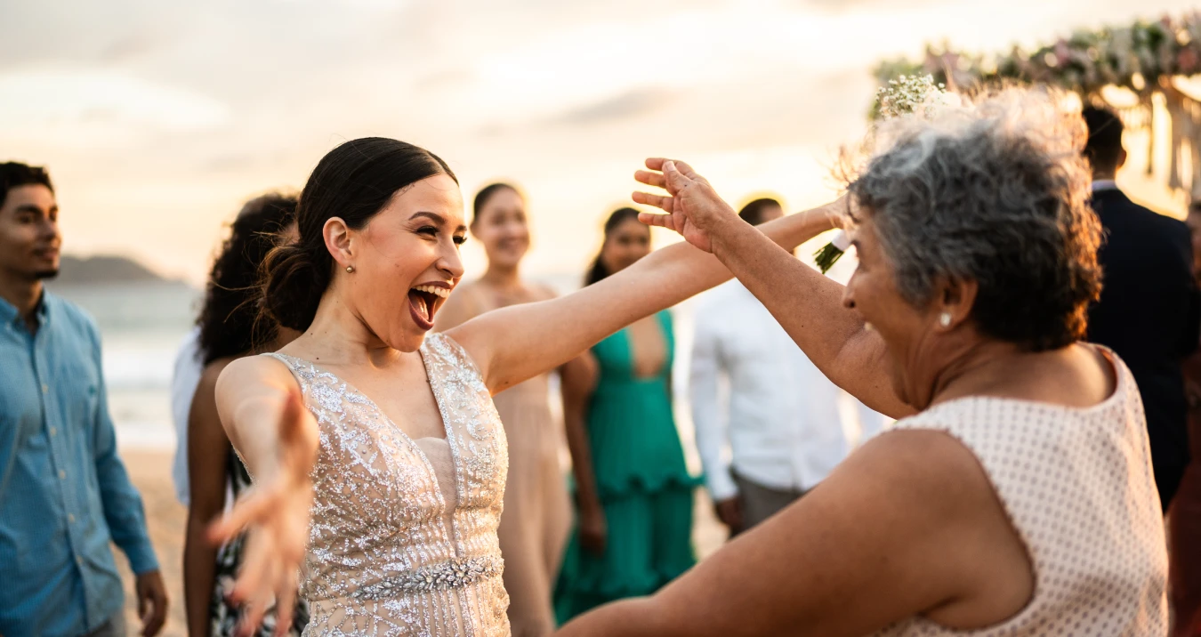 Generations celebrating on beach
