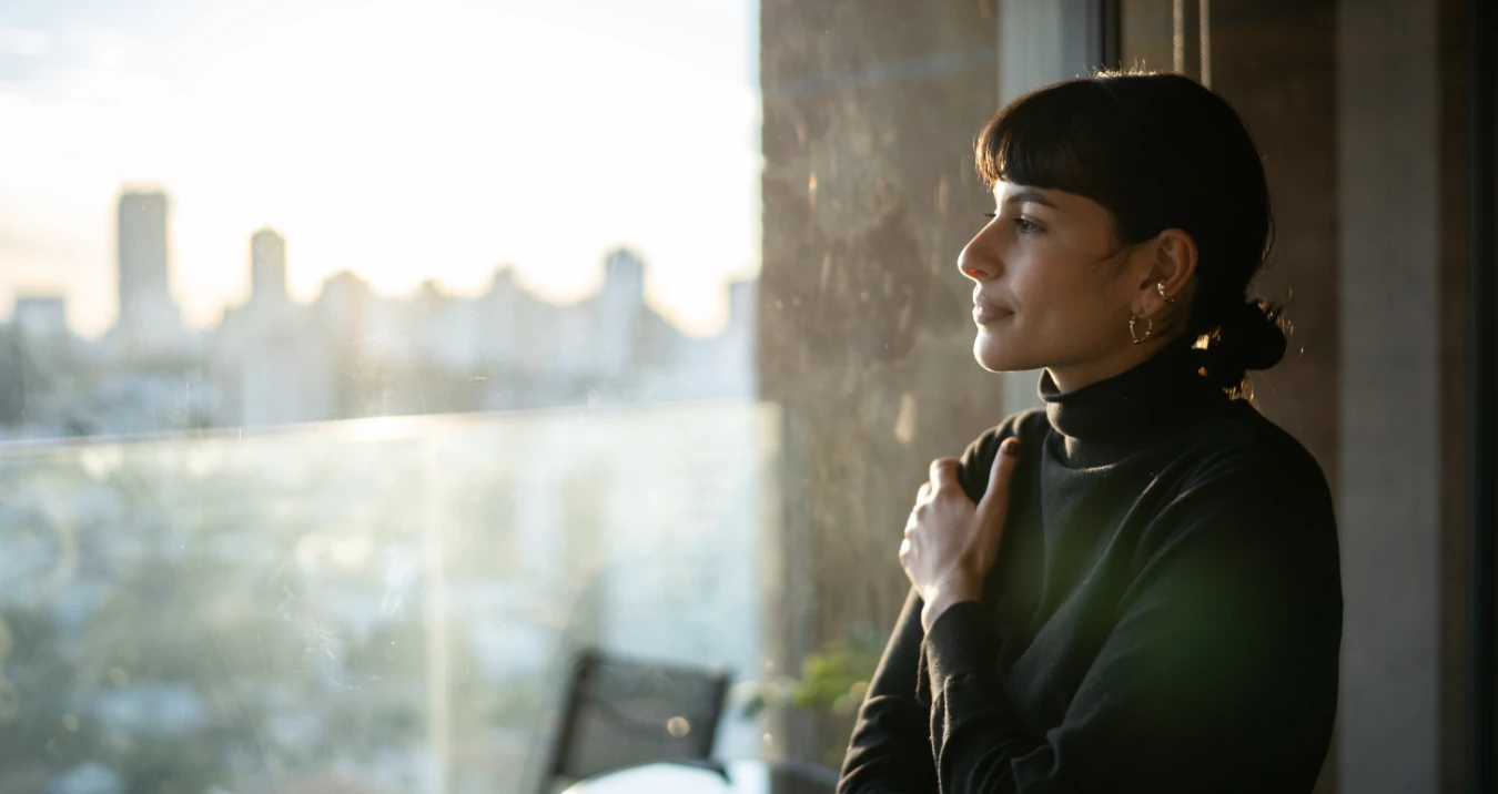 Woman gazing out window