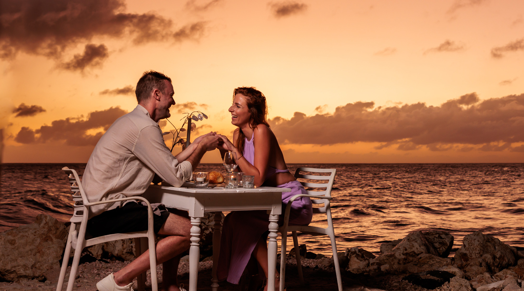 Couple on beach during sunset