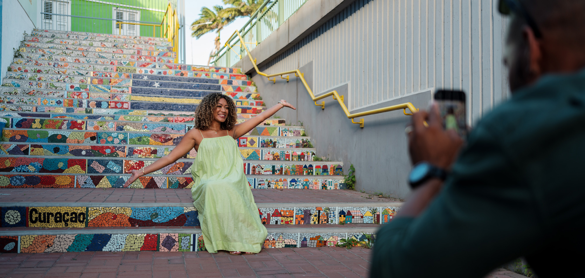 Woman on mosaic stairs