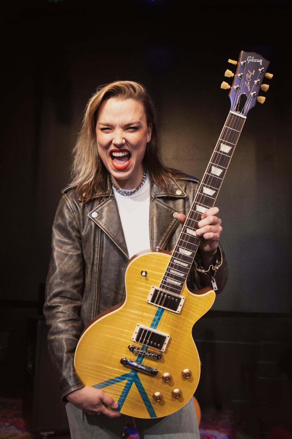 Gibson Ambassador Lzzy Hale of Halestorm is pictured with a Gibson Guitars For Peace Les Paul.