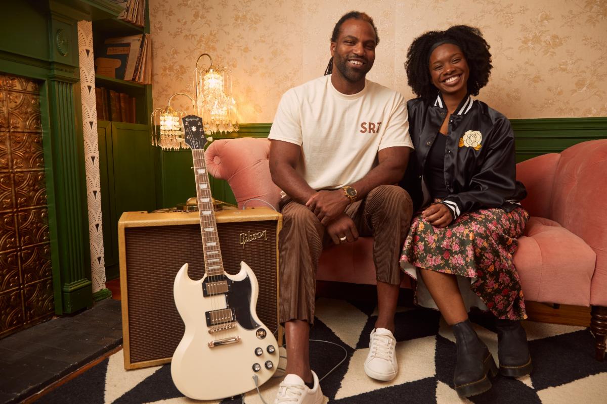 The Sister Rosetta Tharpe Collection in apparel features inclusive sizing, models are pictured with the Epiphone 1961 Les Paul SG Standard.