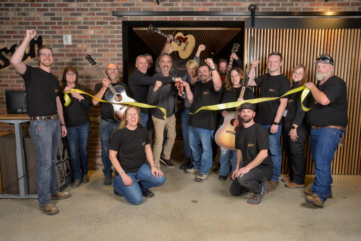 The Gibson team cut the ribbon to open the newly expanded Gibson Acoustic factory in Bozeman.
