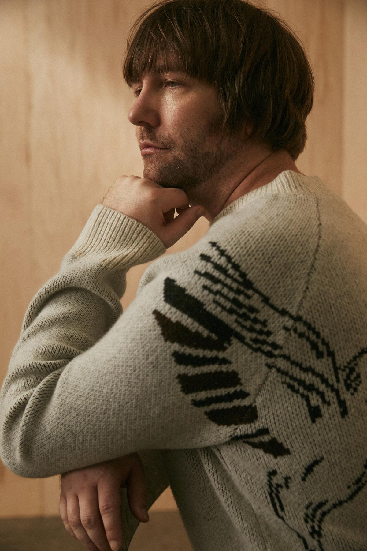 Aaron Lee Tasjan wears the Billy Reid x Gibson Hummingbird Collection crewneck sweater.