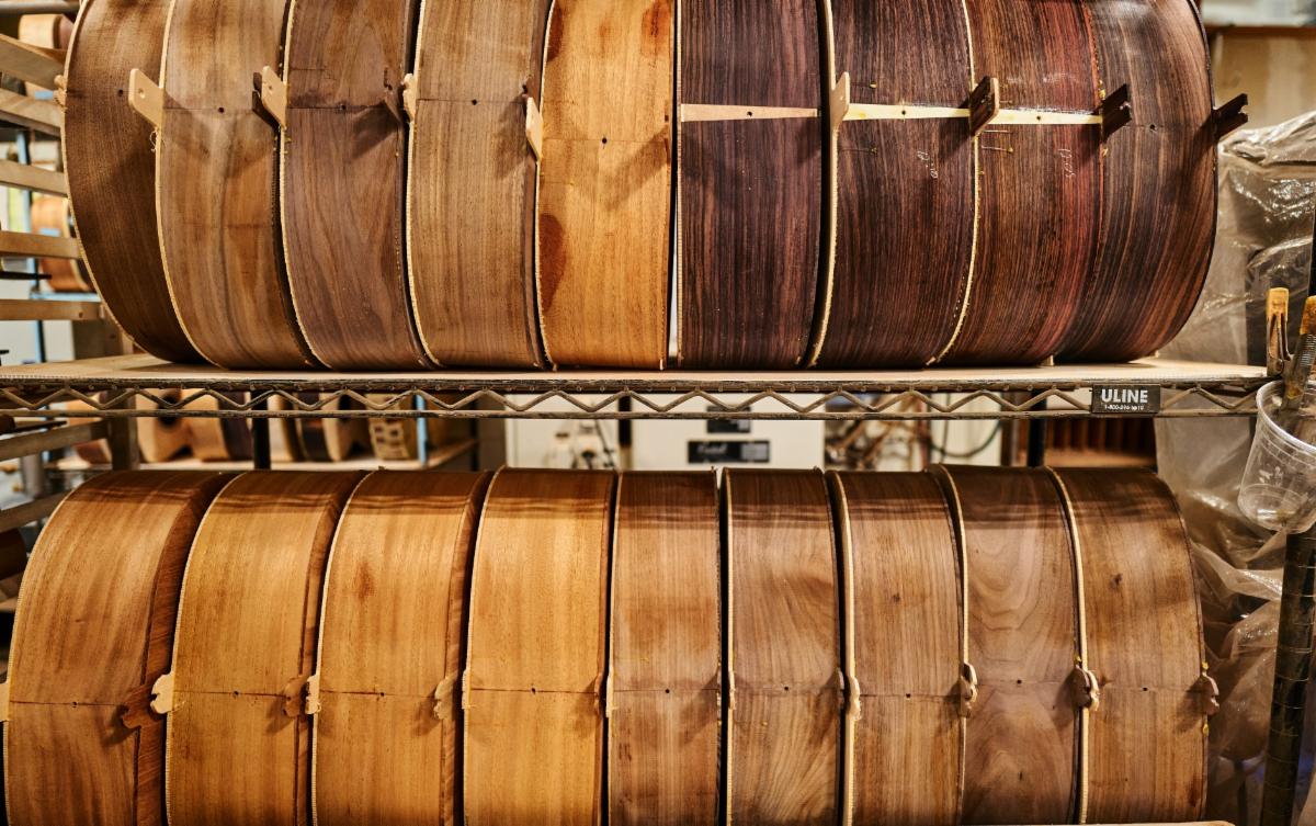 Gibson acoustic guitars in the binding process.