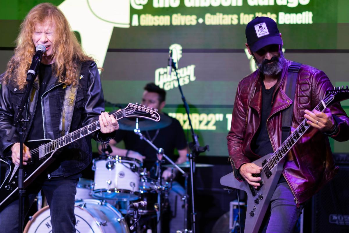 Dave Mustaine of Megadeth and Cesar Gueikian, Brand President, Gibson Brands, perform at the “Rock To Remember” concert at the Gibson Garage in Nashville.