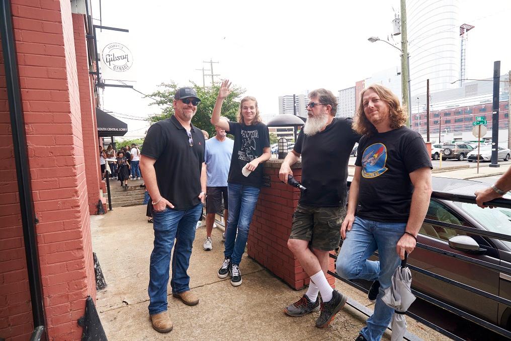 Music fans line up outside for the Gibson Garage grand opening in Nashville on June 9.
