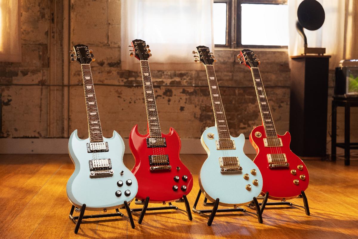 The Epiphone Power Players Collection (L-R) SG and Les Paul in Ice Blue and Lava Red.