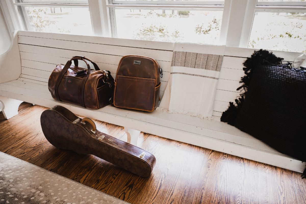 The Lifton Premium Collection (duffle bag, wallet, backpack, and guitar case).