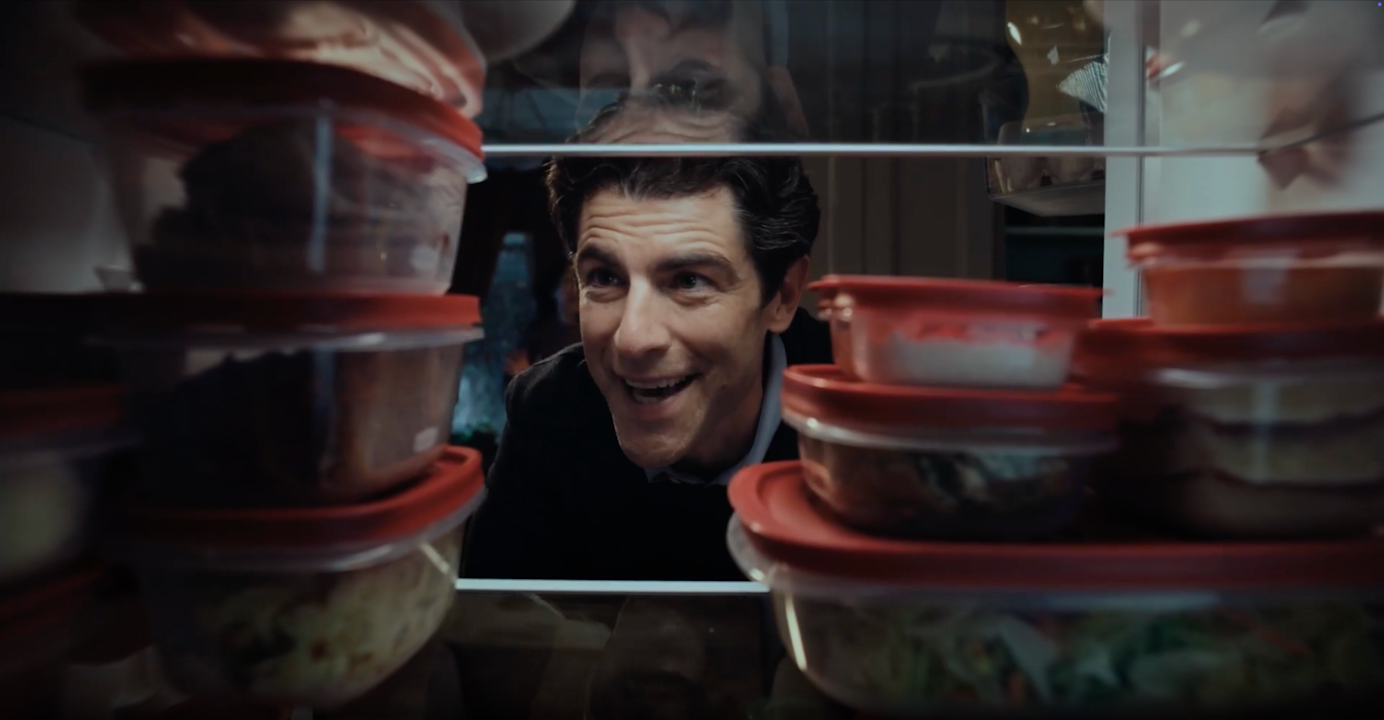 Man looks at all of his food safely stored
