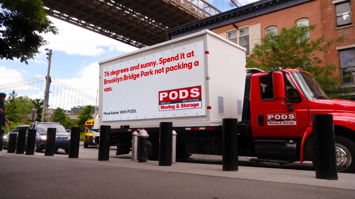 A Pods storage container parked next to the Brooklyn Bridge in NYC