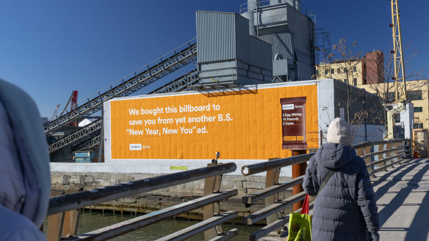 A bright orange billboard blocking viewers from yet another BS New Year, New You ad