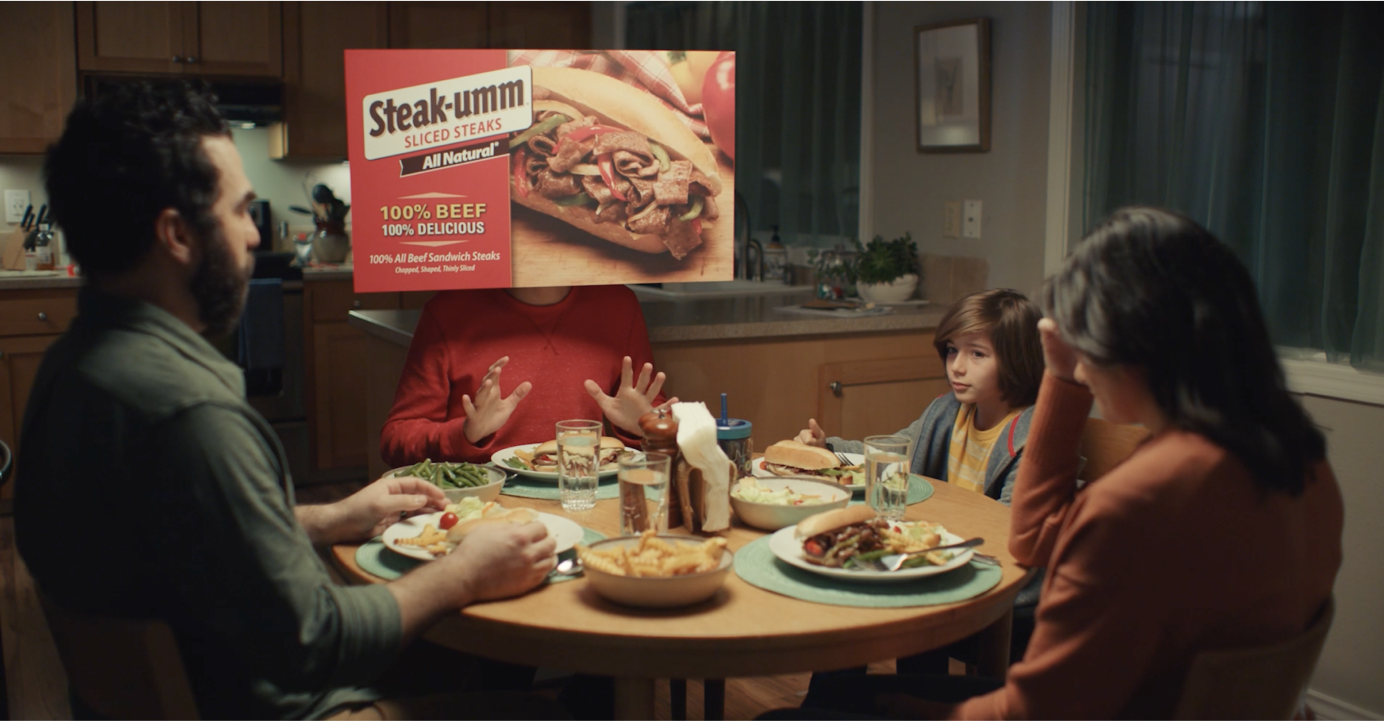 Steak-Umm - "Umm..." campaign still of a family sitting around the dinner table 
