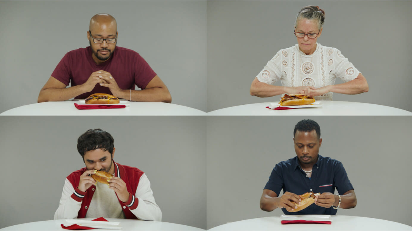 Quadrants with a single focus group participant eating a sandwich