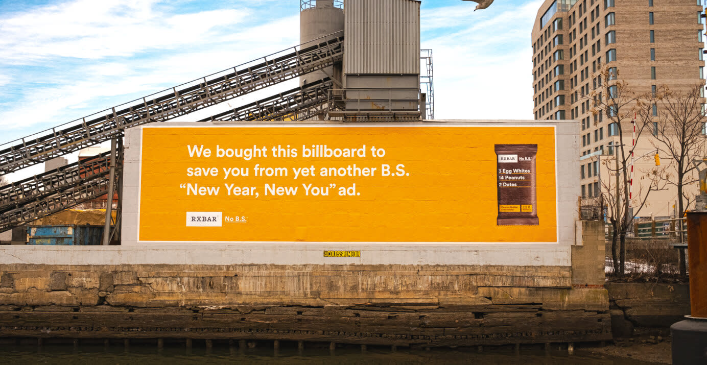 A bright orange billboard blocking viewers from yet another BS New Year, New You ad