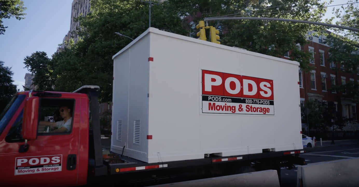 A Pods moving and storage container on the back of a moving truck