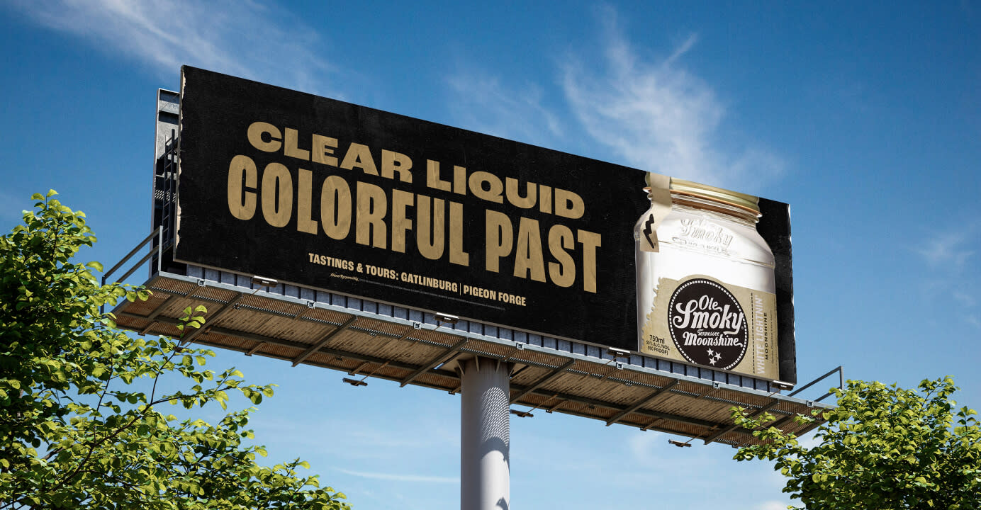 Ole Smokey White Lightning Moonshine on a black billboard with the words Clear Liquid, Colorful Past