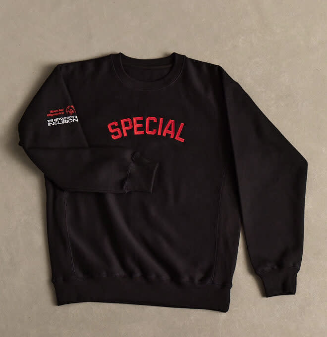 A black shirt with the text "SPECIAL" written on the chest