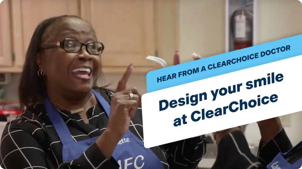 An image of a ClearChoice patient celebrating her new smile with a friend as they sing together in a kitchen, with a banner that says "Hear from a ClearChoice doctor, design your smile at ClearChoice".