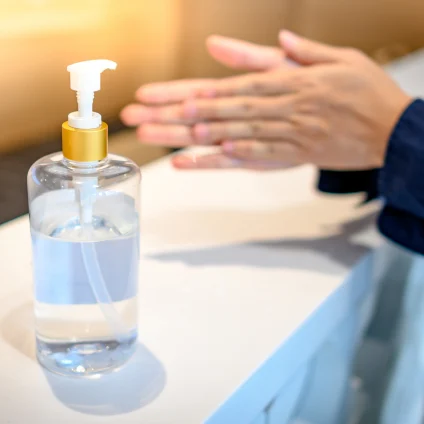 A bottle of hand sanitizer sits on the counter. 