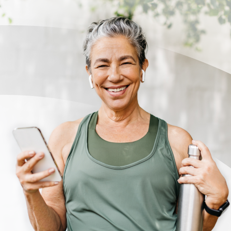 An Aspen Dental implants patient smiles after a workout. 