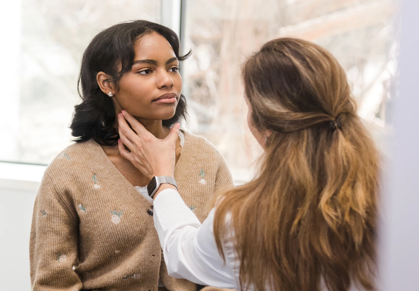 A WellNow doctor examines a patient. 