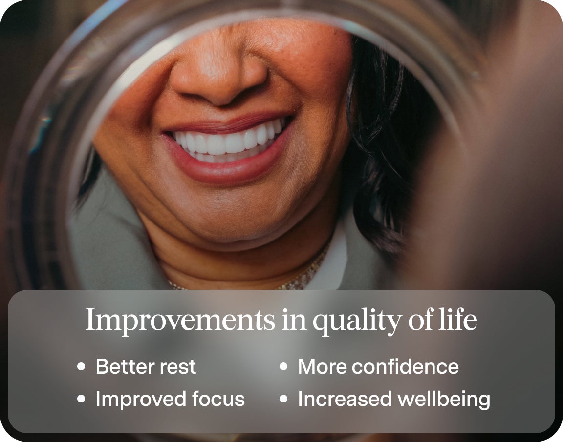 A woman with good oral health smiling into the mirror, with text on some improvements in quality of life that good oral health bring, including better rest, improved focus, more confidence, and increased wellbeing.