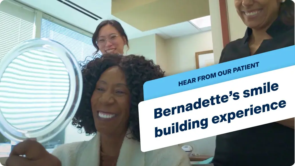 Image thumbnail for Bernadette's testimonial video for ClearChoice, with Bernadette smiling into a hand held mirror with her brand new dental implants.