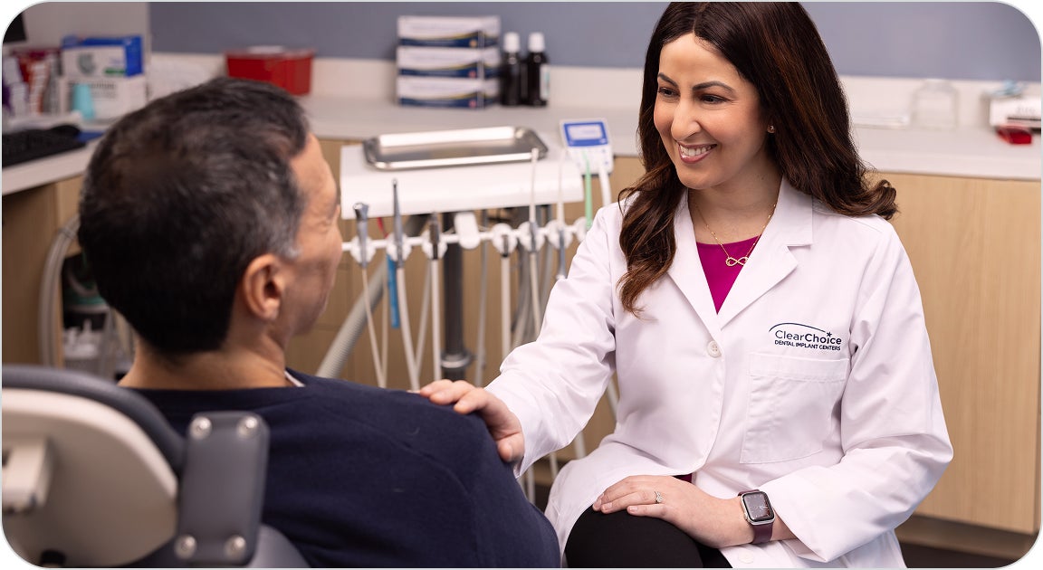 A ClearChoice doctor addressing a patient's questions during their initial consultation, acknowledging their concerns and providing a thorough rundown so the patient knows what to expect from the process.