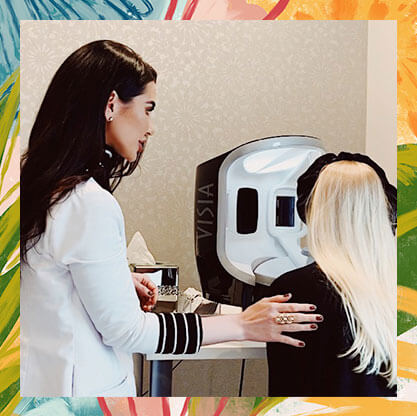 Chapter aesthetic advisor helps guest place her head in the proper position for a dermal image scan