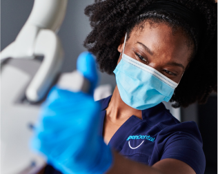 An Aspen Dental doctor prepares for a root canal. 