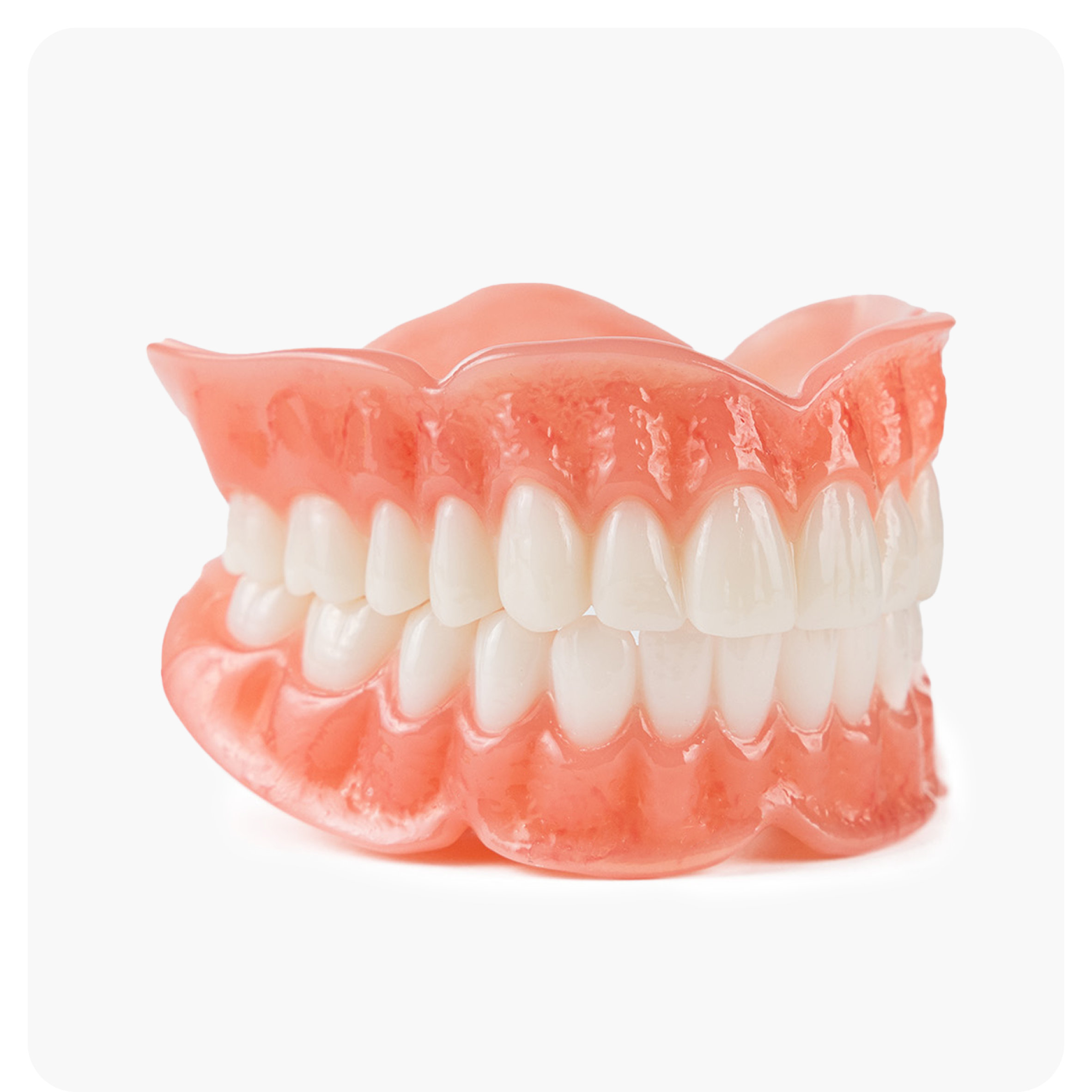  High-quality full denture set with a natural gum and tooth design, featured on the Aspen Dental SIG Elite page.