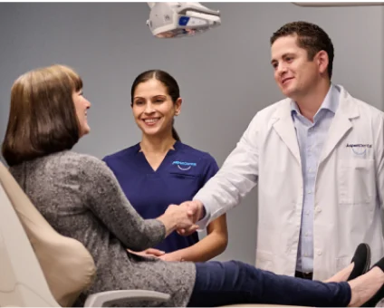 Aspen Dental doctor and patient shaking hands