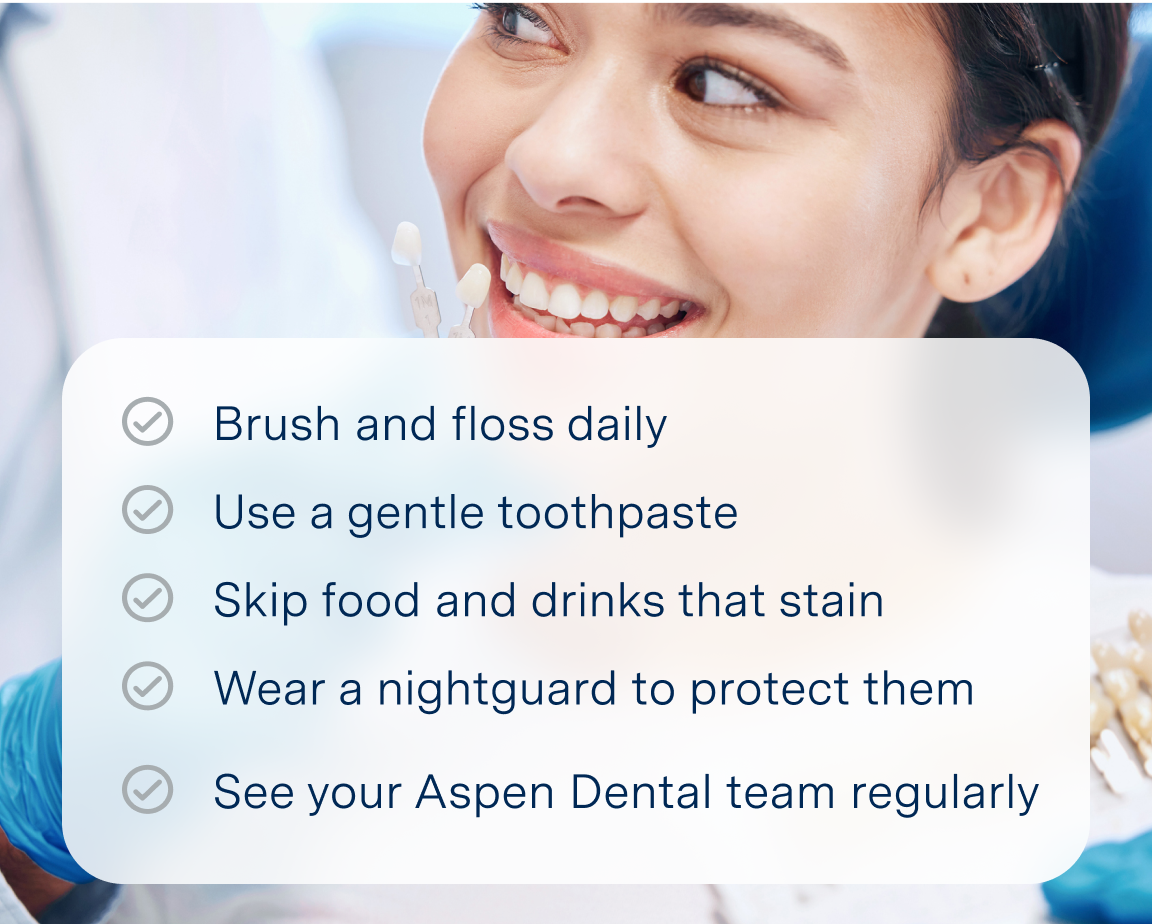 An image of a smiling woman overlayed with the text "Brush and floss daily, use gentle toothpaste, skip food and drinks that stain, wear a nightguard to protect them, see your Aspen Dental team regularly"