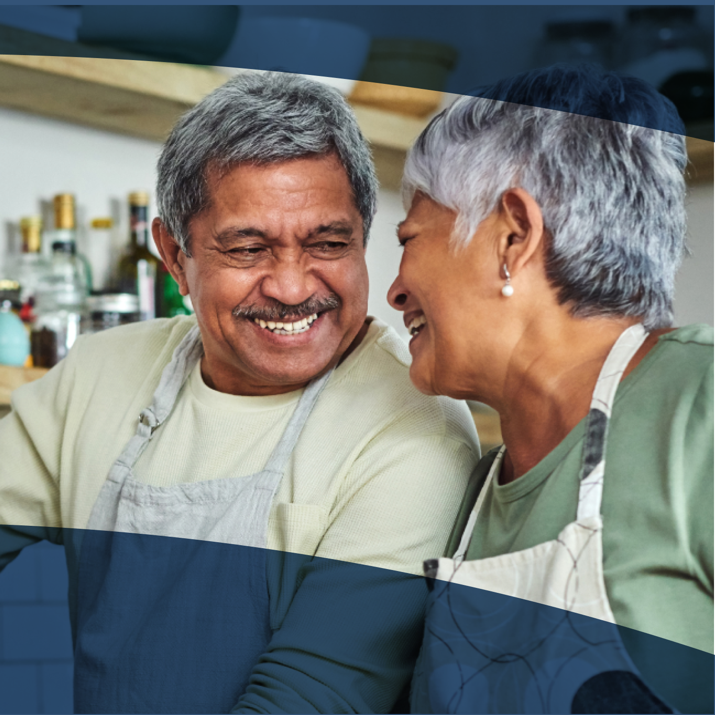 Image of a man enjoying cooking with his wife as he enjoys all of his favorite foods with implant dentures.