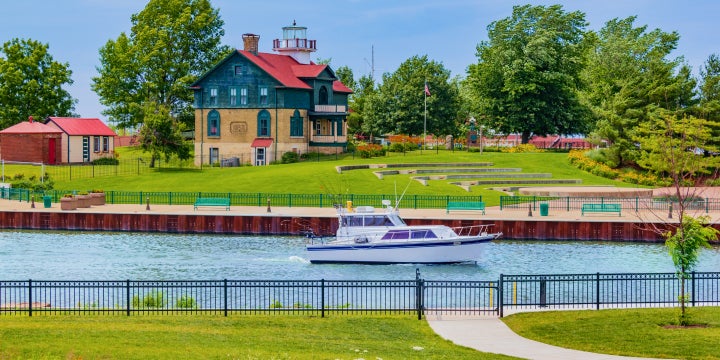 A boat floats down a river that runs through a northwest Indiana park. 