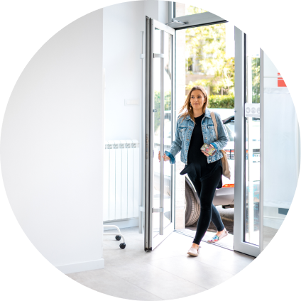A WellNow patient walks in the front door of a clinic. 