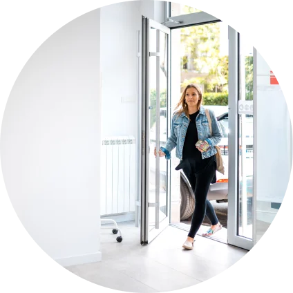 A WellNow patient walks in the front door of a clinic.