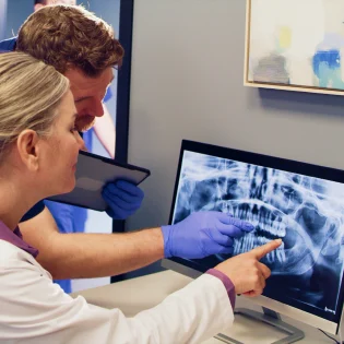 Aspen Dental doctors look at X-rays. 