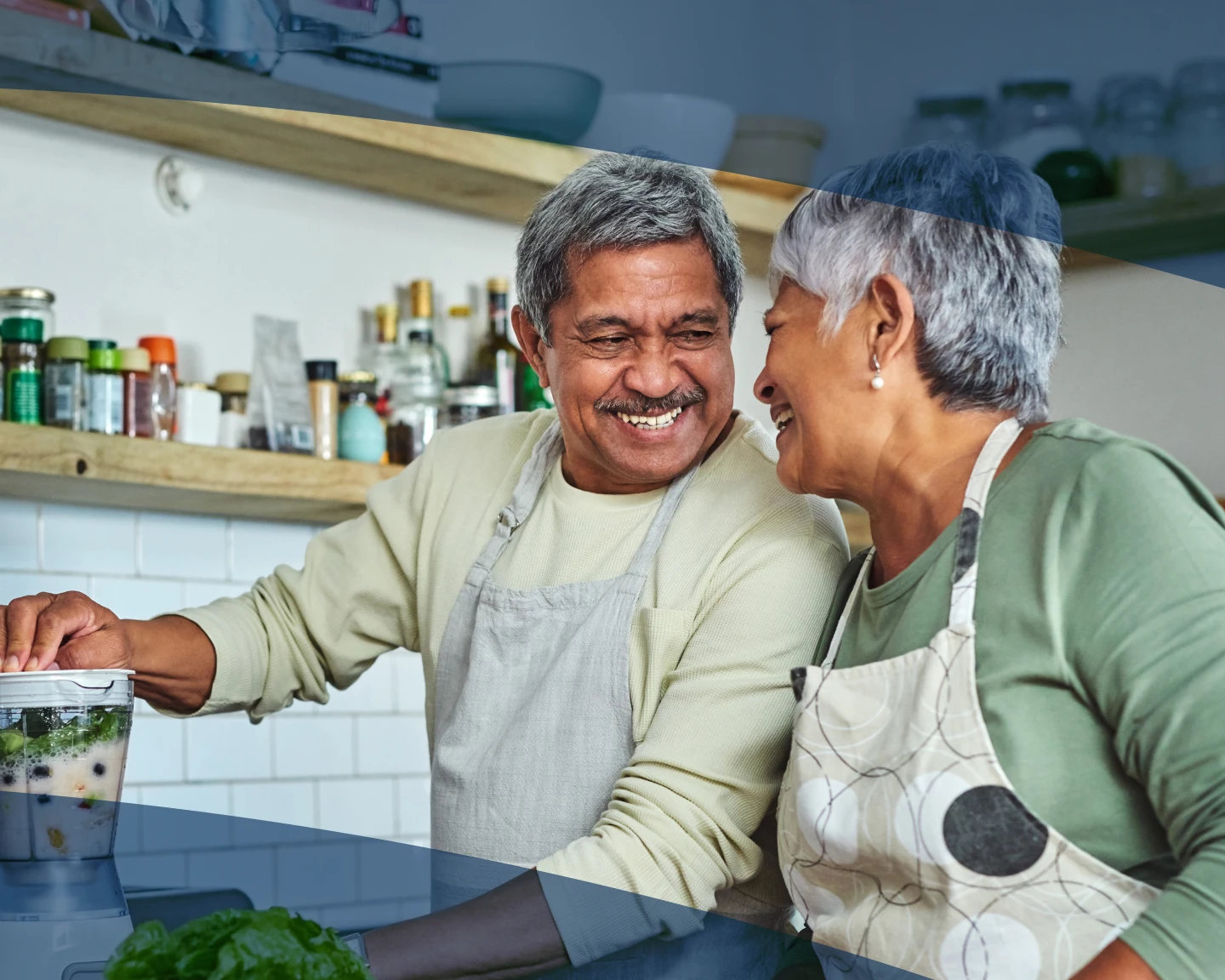 Happy older couple cooking together in a kitchen, with blue tinted overlays in corners.