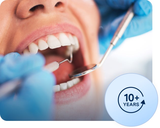  A dental professional in blue gloves examines a patient's teeth with dental tools. A circular badge at the bottom right states "10+ Years.