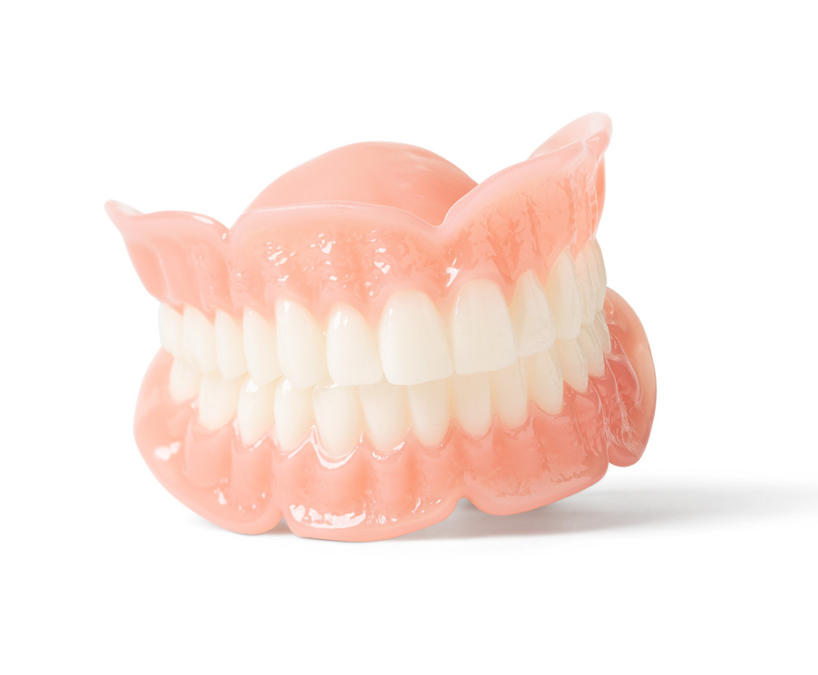 A full set of upper and lower dentures displayed against a white background.