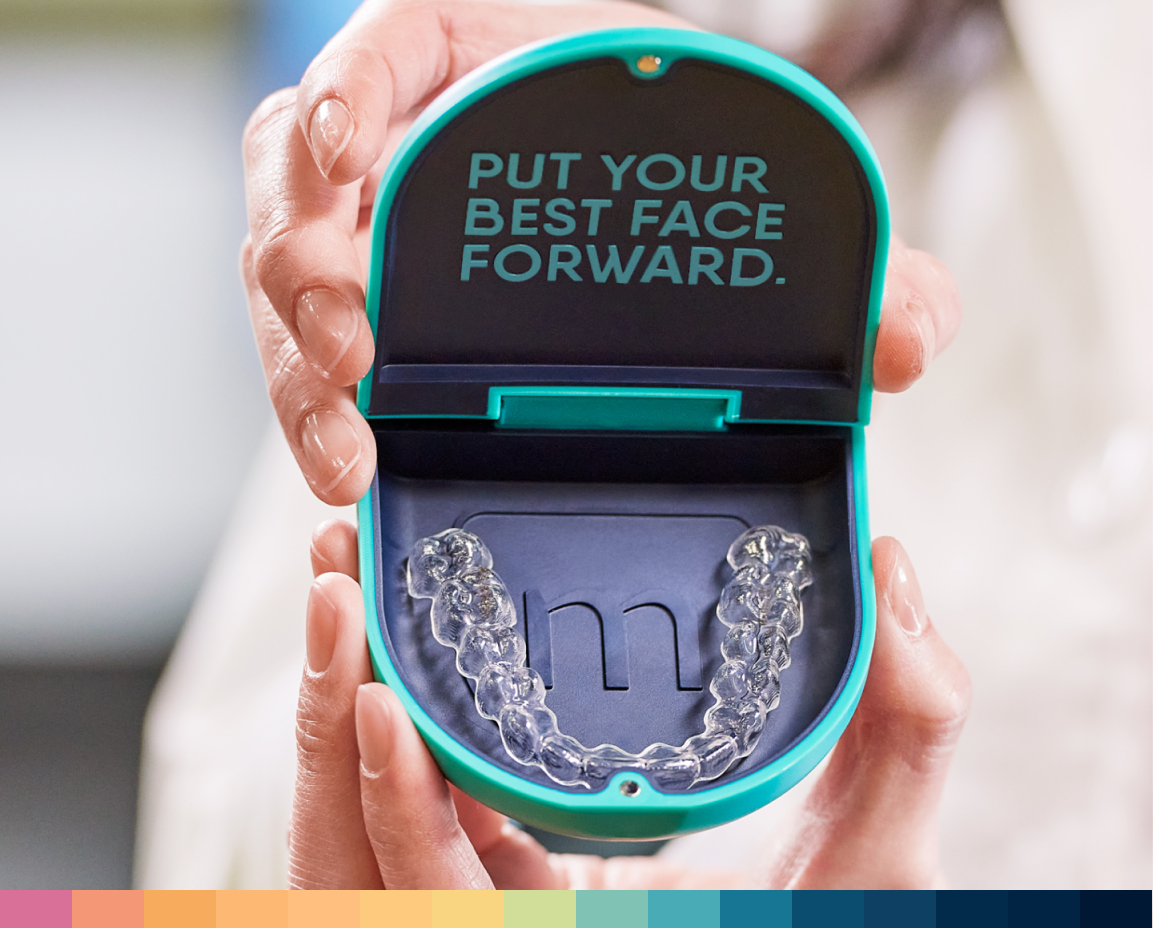 Hands holding Motto aligners case with text PUT YOUR BEST FACE FORWARD.