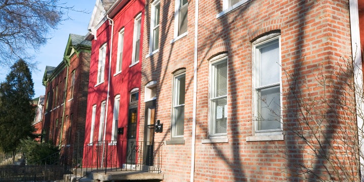 A street lined with brick houses in the south chicago suburbs. 
