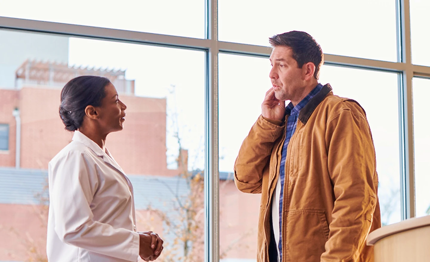 A patient consulting with an Aspen Dental emergency dentist, emphasizing immediate care and support for dental emergencies near you.